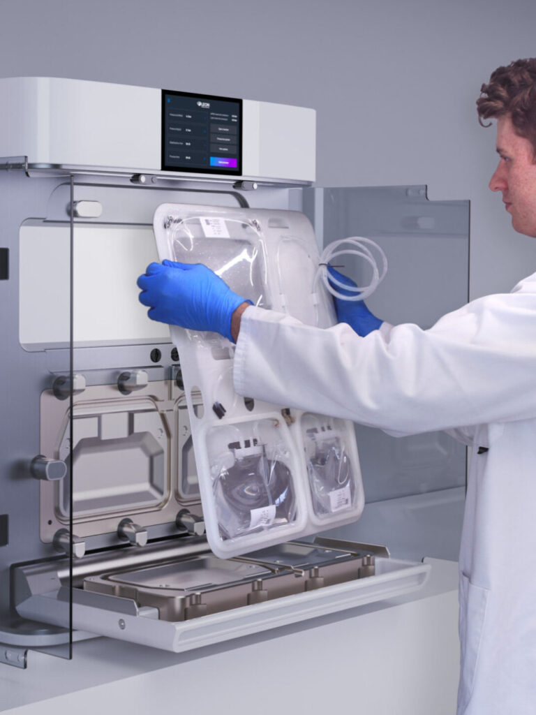 Technician loading a disposable cassette into the NANOme® system